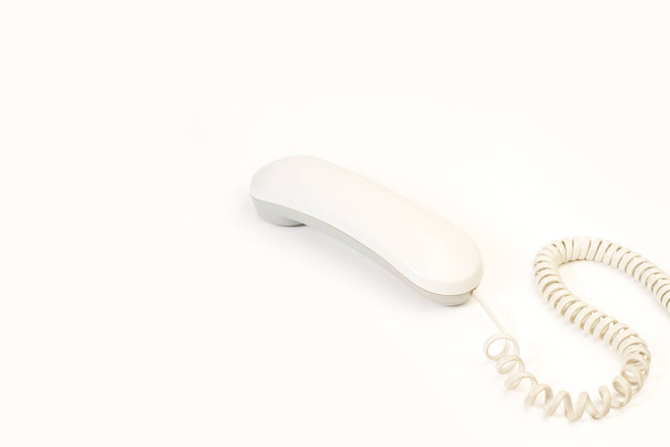 A digital telephone receiver on a white background with copy space - Zdjęcie, obraz