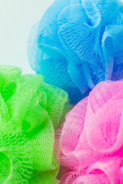 close up view of pink, green and blue mesh sponges isolated on grey - Valokuva, kuva