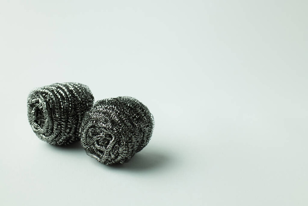 abrasive steel scourers on grey background with copy space - Foto, afbeelding