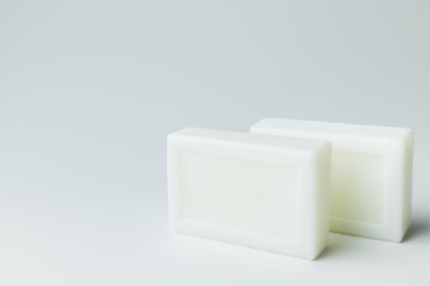 white toilet soap bars on grey background - Фото, изображение