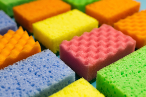close up view of different multicolored washcloths on blurred background - Fotó, kép