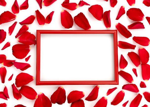 Red rose petals on a white background. Frame with place for your text. Valentine's Day. Mockup - Zdjęcie, obraz