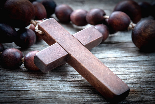 Close up old rosary against as a symbol of salvation and eternal life of human soul - 写真・画像