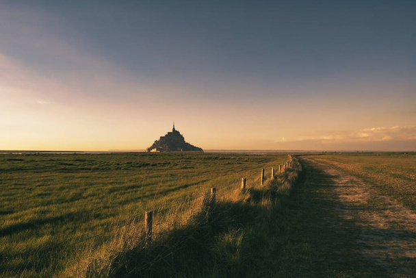 Le Mont Saint-Michel in beautiful evening twilight at dusk, Normandy, northern France - Zdjęcie, obraz