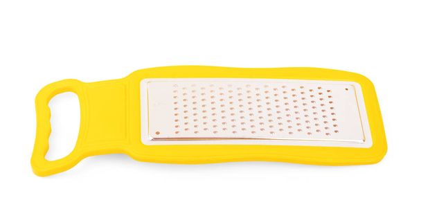 Grater for vegetables on a white background. Kitchen grater clos - Photo, image