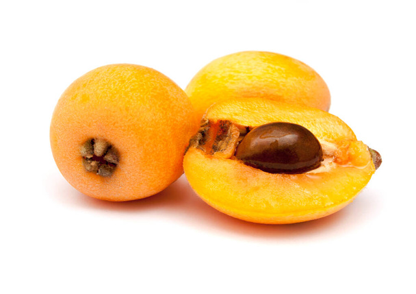 Loquats fruits isolated on white background. Group of Japanese orange fruit medlars, exotic, juicy sweet plums. - Zdjęcie, obraz