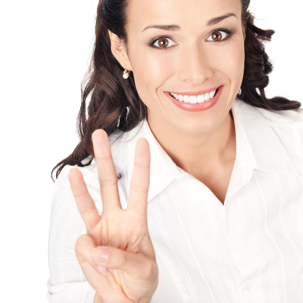 Businesswoman showing three fingers, on white - Foto, Imagen