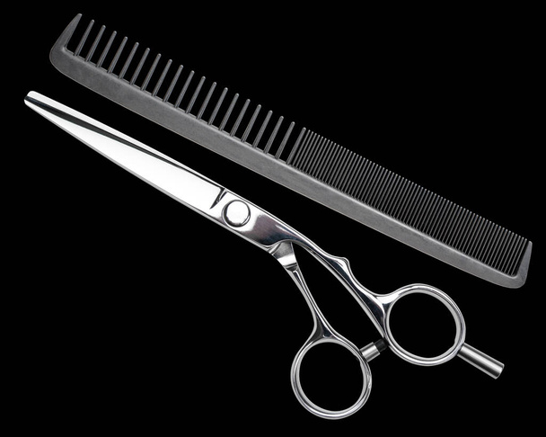 Scissors and comb. Professional barber scissors or shears, comb for man or woman haircut. Hairdresser salon equipment. Hair cutting carbon comb. Premium hairdressing accessories, hairbrush. - Photo, Image