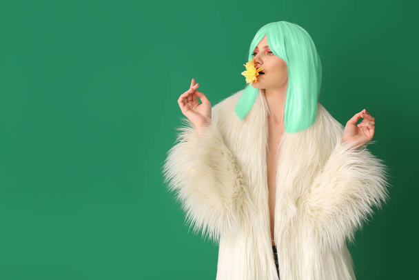 Stylish young woman with green hair on color background - Valokuva, kuva