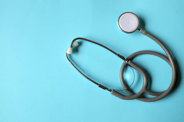 Stethoscope  on a blue background. Health care concept. - Fotoğraf, Görsel