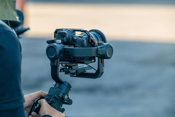 Gimbal stabilizer with mirrorless digital camera anti shake for video production cinematography - Φωτογραφία, εικόνα