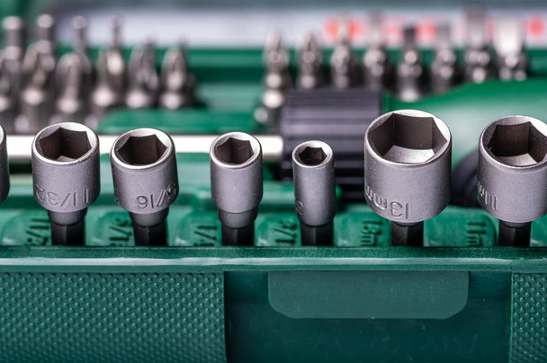Interchangeable screwdriver set with different types of metal steel heads and bits, selective focus - Photo, image