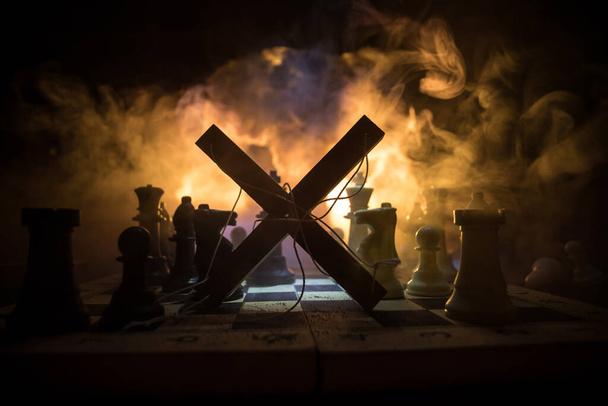 Concept of war or manipulation with global politics. Conceptual image of war using chess board and manipulation symbol. Selective focus - Fotó, kép