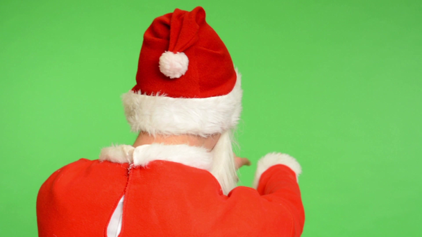Joulupukki - vihreä ruutu - studio - joulupukki seisoo takana - Joulupukki valitsee ihmiset ja kutsuu heidät luokseen
 - Materiaali, video