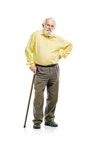 Bearded man walking with cane - Foto, Bild
