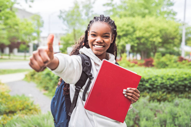 cute black teenager university student on campus with backpack - Foto, imagen