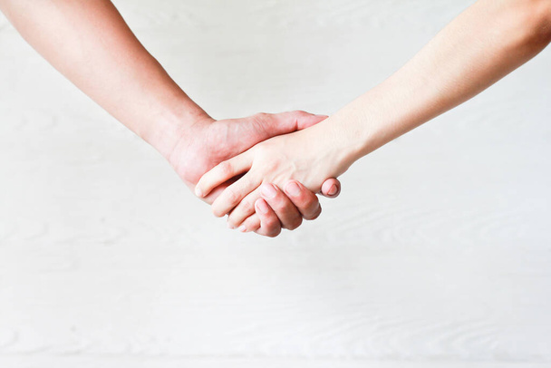 Women handshake concept relationships, love and business background of wood. - Foto, Imagen