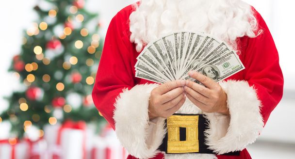 close up of santa claus with dollar money - Foto, afbeelding