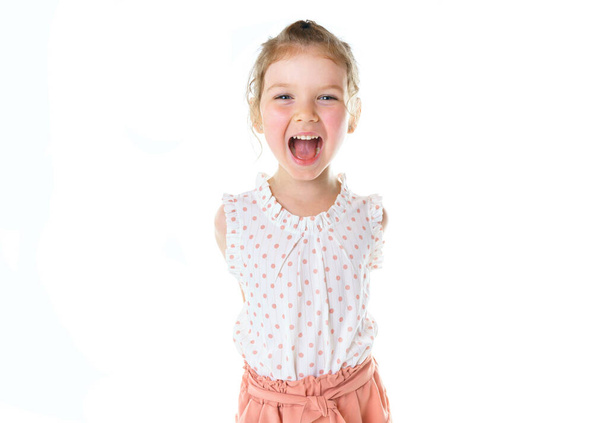 cute five year old caucasian girl yell isolated on white. - 写真・画像