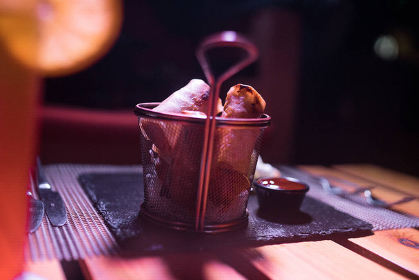 Crispy Briouats on a metallic bowl on the table - Фото, зображення
