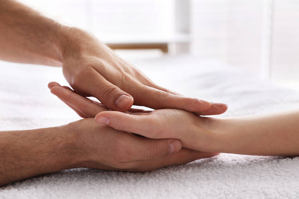 Woman receiving hand massage in wellness center, closeup - Foto, afbeelding