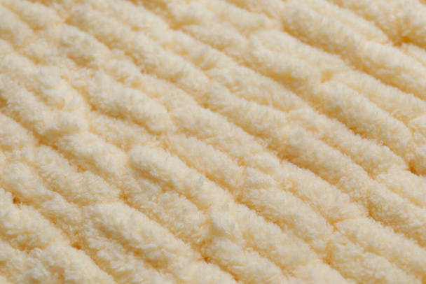 Soft beige knitted fabric as background, closeup - Photo, Image