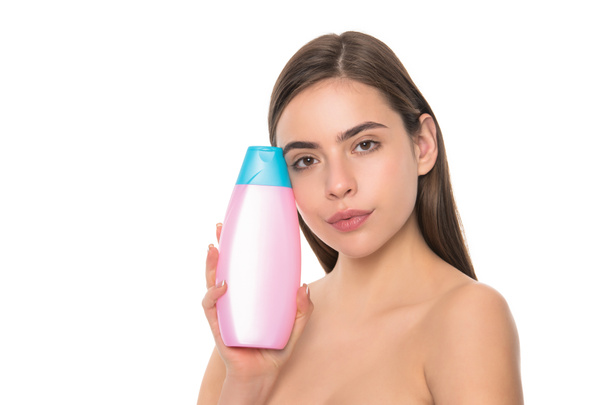 presenting female cosmetic product. woman use shampoo. - Фото, изображение