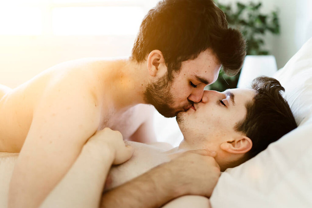 homosexual couple under a bed at home - Fotó, kép