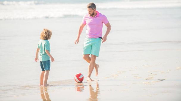 positive family of daddy man and child boy playing ball on beach, fathers day - Foto, Imagem