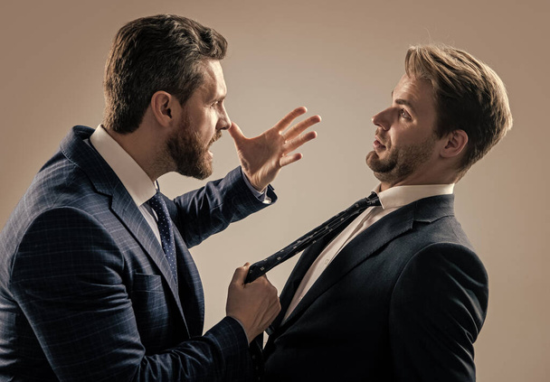 two angry businessmen fighting and arguing having struggle for leadership, rivalry. - Fotografie, Obrázek