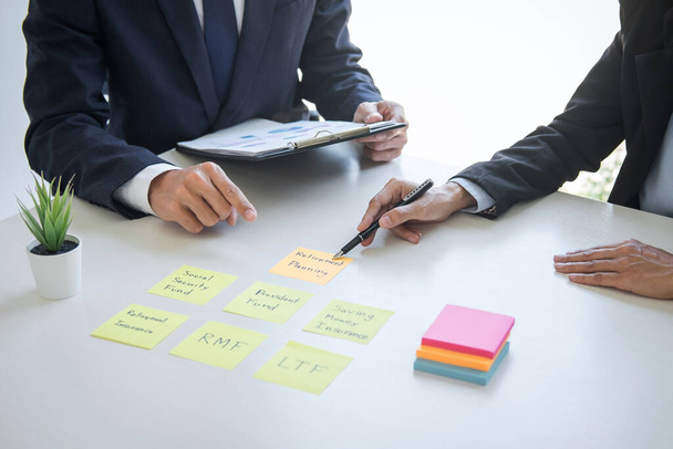 Business team executive accounting analyzing and calculation on valuation data investment fund looking at report, sticky note paper and having a consultation, Wealth Management and investment concept. - Foto, imagen