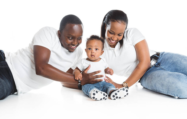 Young African American family in the studio with baby toddler son - Foto, Imagen