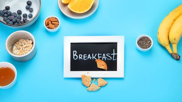 Healthy breakfast on colourfull background. Flatlay with tasty food. Brunch menu. Top view, copy space - Photo, Image