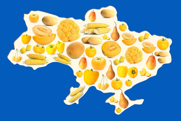 Map of Ukrainian country made of yellow fruits and vegetables on blue background - Фото, изображение