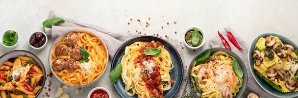 Italian pasta assortment on light background. Traditional food concept. Flat lay, Top view, copy space, panorama - Foto, imagen