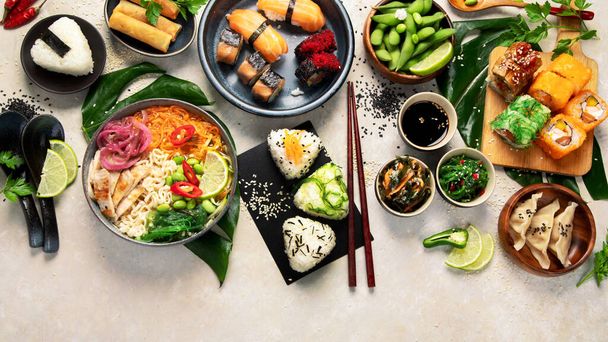 Japanese food assortment on light background. Traditional food concept. Dishes and appetizers of indeed cuisine. Top view, flat lay, copy space - Φωτογραφία, εικόνα
