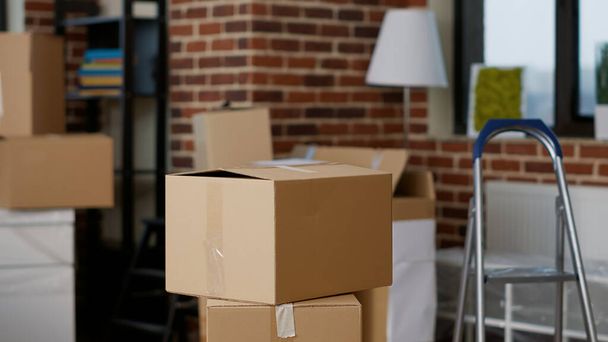 Stacks of cardboard boxes in empty real estate property - Photo, Image