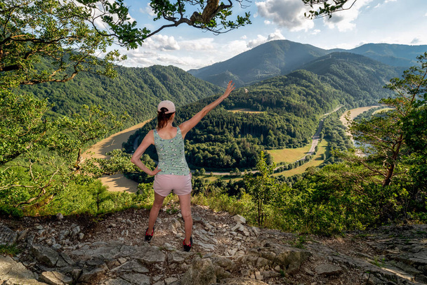 Hiker girl looking on Domasin meander of river Vah in Slovakia. Beautiful summer nature landscape - Φωτογραφία, εικόνα