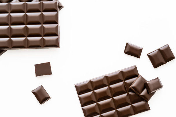 Top view of chocolate bars and pieces isolated on white  - Фото, изображение