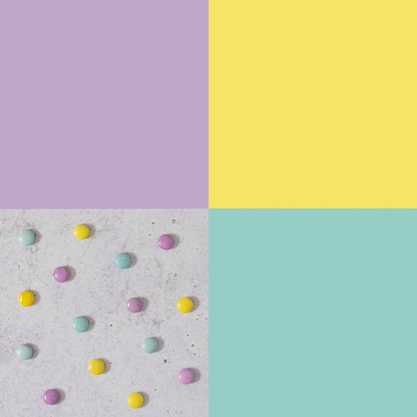 Colorful background concept made with pastel colored candy. Simple geometric design. - Fotó, kép