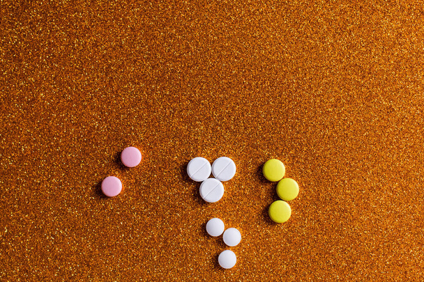 top view of different colorful round shape pills on shiny background  - Zdjęcie, obraz