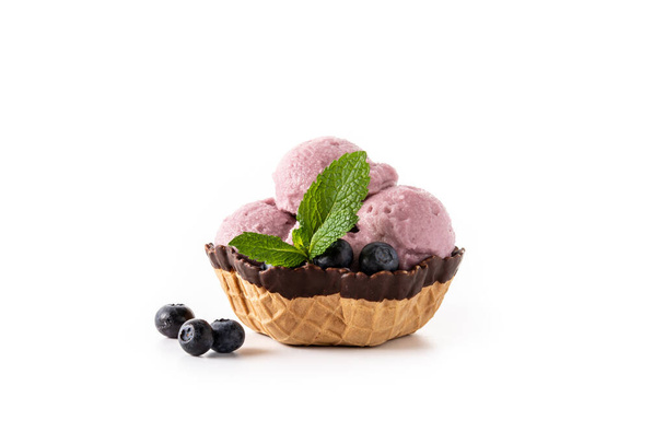 Blueberry ice cream scoop in waffle basket isolated on white background - Foto, Imagem