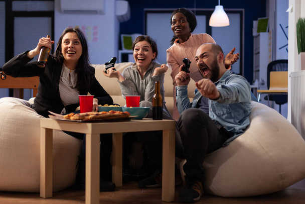 Business people celebrating video games play win in office - Foto, Imagem