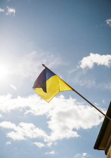 View from below of peacefully waving Flag of Ukraine - Photo, Image