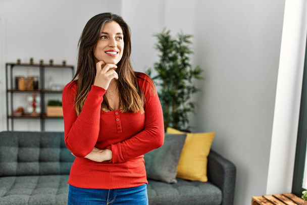 Young woman smiling confident with arms crossed gesture at home - Foto, imagen
