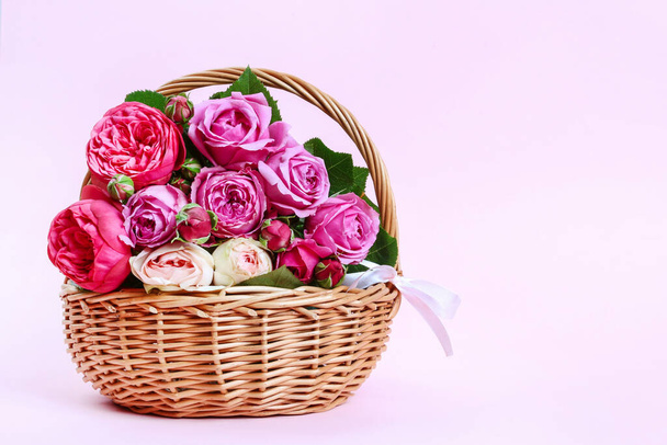 Wicker basket with pink roses. Romantic postcard motif. Graphic resources - Foto, Imagem