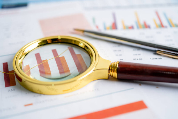 Magnifying glass on charts graphs paper. Financial development, Banking Account, Statistics, Investment Analytic research data economy, Stock exchange trading, Business office company meeting concept. - Photo, Image