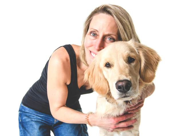 Nice woman and her beautiful Golden Retriever dog over white background - Foto, Imagem