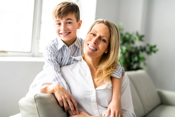 A people and family happy boy with mother on sofa at home - Φωτογραφία, εικόνα