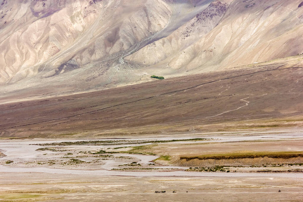 The epic landscape of the Zanskar river flowing through the arid mountains in Ladakh in the Indian Himalaya. - Photo, Image